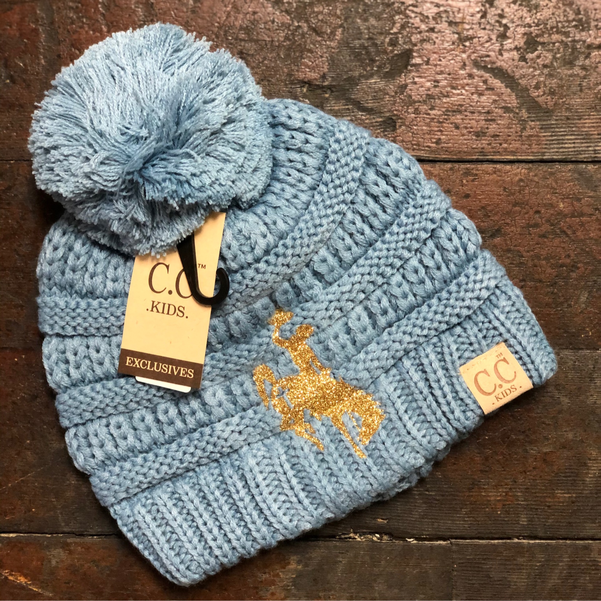 Denim Blue CC Kids Solid Pom Beanie with Metallic Gold Cross Bucking Bronc 0386